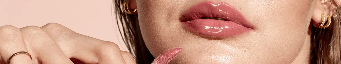 Maybelline Lip gloss products illustrative banner image - Close up of a woman's lips with lip gloss